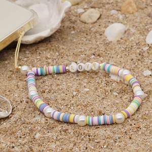Bohemian colorful clay bead phone lanyard with LOVE letters and pearls on beach
