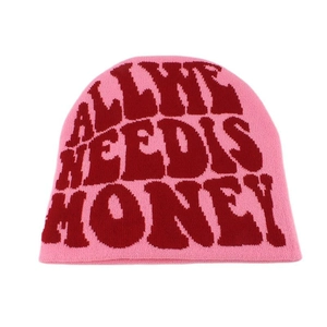 Pink knitted beanie featuring red 'ALL WE NEED IS MONEY' jacquard text detail