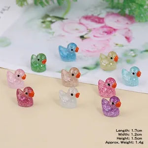 Miniature luminous resin ducks set in assorted colors with glitter finish for DIY crafts