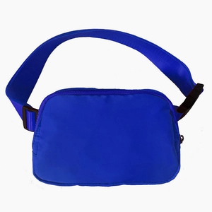 Detailed close-up of blue nylon running belt bag with matching strap and black buckle