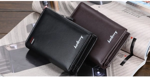 Detailed close-up of brown and black leather zipper wallets on an open magazine