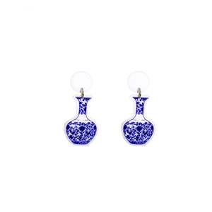 Detail of blue and white porcelain style vase earrings with traditional patterns