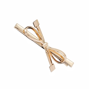 Metallic gold bow hair clip with a sleek minimalist design for women's hair styling