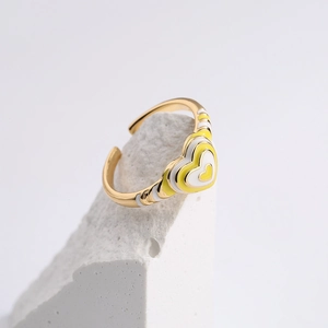 18K gold plated heart enamel open ring with yellow and white dual-tone design on white rock