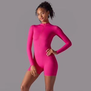Close-up of bright rose pink long-sleeve bodysuit with seamless zipper and athletic fabric