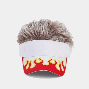 Detail of red flame embroidery and thick brown synthetic hair on a white baseball cap