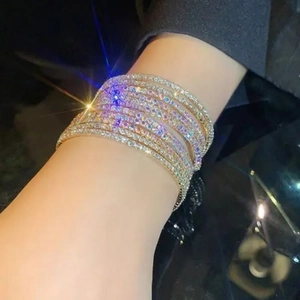 Detail shot of multi-layer stretch bracelets with sparkling crystals on a wrist