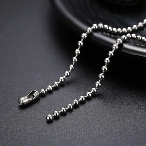 Detailed macro view of silver titanium steel bead chain with secure connector link