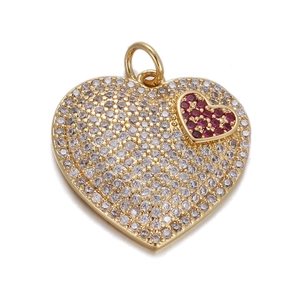 Detailed close-up of a heart pendant with white and red crystals on a gold base