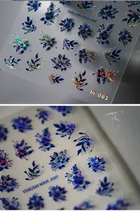 Macro detail of holographic blue flower nail stickers with laser outline effects
