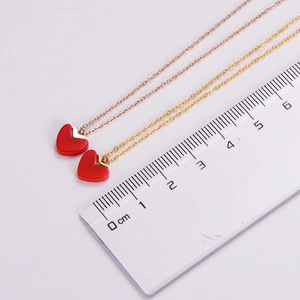 Detailed measurement of red heart pendant necklace in rose gold finish with 1cm size scale