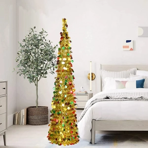 Detail of a folding golden Christmas tree with colorful sequins in a cozy bedroom setting