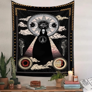 Detail of bohemian skull tapestry with mystic sun and moon design in a home setting