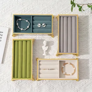 Luxury velvet jewelry display trays with gold metal frames for rings and bracelets