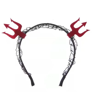 Detailed view of red devil trident headband with elegant black lace trim for costume party