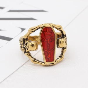 Gothic punk mummy coffin ring in antique gold with skull details and red inlay