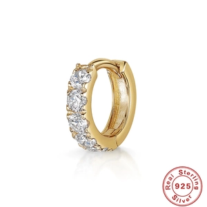 Detailed macro view of gold-plated 925 sterling silver earring with five cubic zirconias