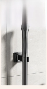 Detail of wall-mounted dark grey storage base for toilet brush with vertical handle slot