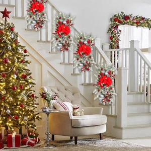 Close-up of LED Christmas wreath with red bows, pine cones and silver baubles decoration