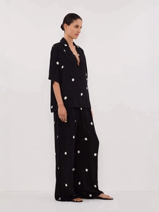 Women's black polka dot chiffon pajama set with short sleeve shirt and wide leg pants