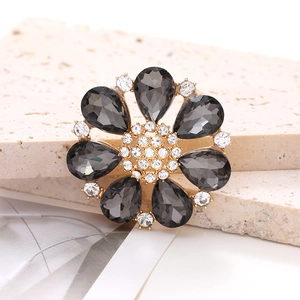 Elegant gold alloy sunflower charm featuring grey crystals and white rhinestones
