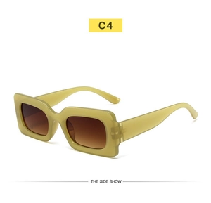 Detail view of rectangular sunglasses in olive green with brown gradient lenses