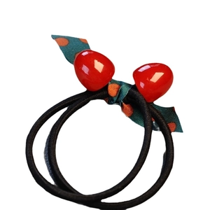 Elastic hair ties with red cherry charms and orange polka dot ribbon bow decoration