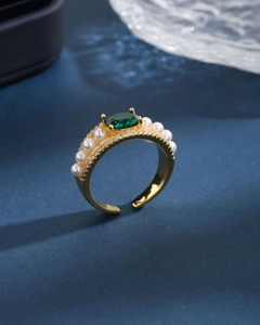 Luxurious gold-plated ring with emerald gemstone, white pearls, and diamond accents