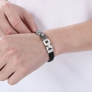 Close-up of men's leather braided bracelet with matte silver stainless steel chain links