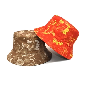 Double-sided ethnic bucket hats in brown and red with vintage floral and fan patterns