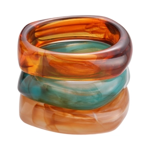 Three-piece retro acrylic bangle set with marbled textures in amber and teal tones