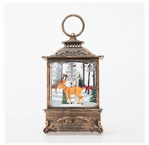 Detail of vintage Christmas lantern with miniature deer and white birch trees inside