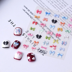 Detailed macro view of 5D embossed bow nail stickers in various colors with sample tips