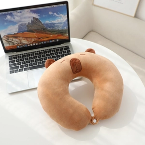 Detail of Capybara U-shaped neck pillow with soft plush fabric and snap button closure
