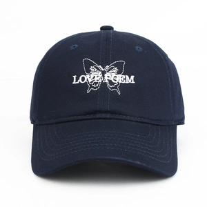 Close-up of navy baseball cap with white butterfly and LOVE POEM embroidery detail