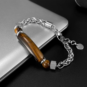 Detailed close-up of tiger eye stones and silver stainless steel chain link bracelet