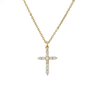 Macro shot of gold cross pendant with micro-paved 3A cubic zirconia in a hip hop style