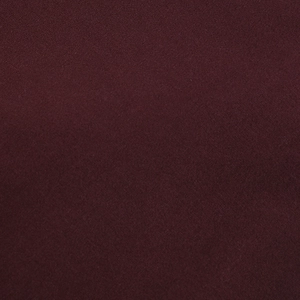 Detailed macro view of high-quality dark burgundy fabric texture and fine knit weave