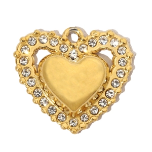 Detail of golden double-layer heart pendant with sparkling white rhinestones inlay