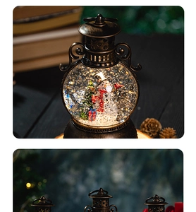 Detailed close-up of a bronze Christmas snow globe lantern with snowman and pine cones
