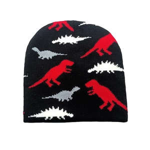 Close-up of black knitted beanie featuring colorful dinosaur jacquard patterns for kids