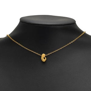 Polished gold stainless steel necklace featuring a mother and baby pendant on black bust
