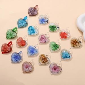 Handmade heart-shaped glass pendants with 3D flower motifs in various vibrant colors