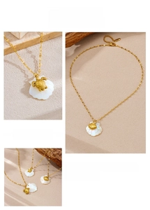 Detailed views of 18K gold plated ocean necklaces featuring starfish and shell charms