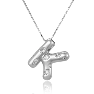 Close-up of silver-plated letter K pendant with micro-paved zircons on a box chain