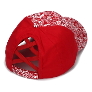 Detail of red paisley baseball cap with criss-cross elastic ponytail holder at back