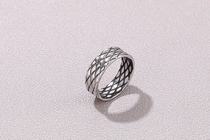 Macro view of vintage silver ring featuring a detailed quilted fish scale texture