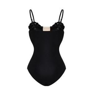 Detail of black one-piece swimsuit featuring ruffled trim and adjustable thin shoulder straps