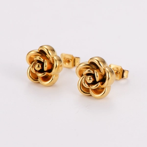 Close-up of golden stainless steel 3D rose flower stud earrings on white background