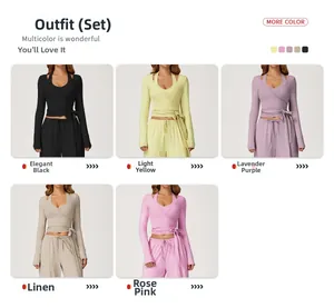 Detail view of lace-up long sleeve wrap crop top and wide leg yoga pants in five colors